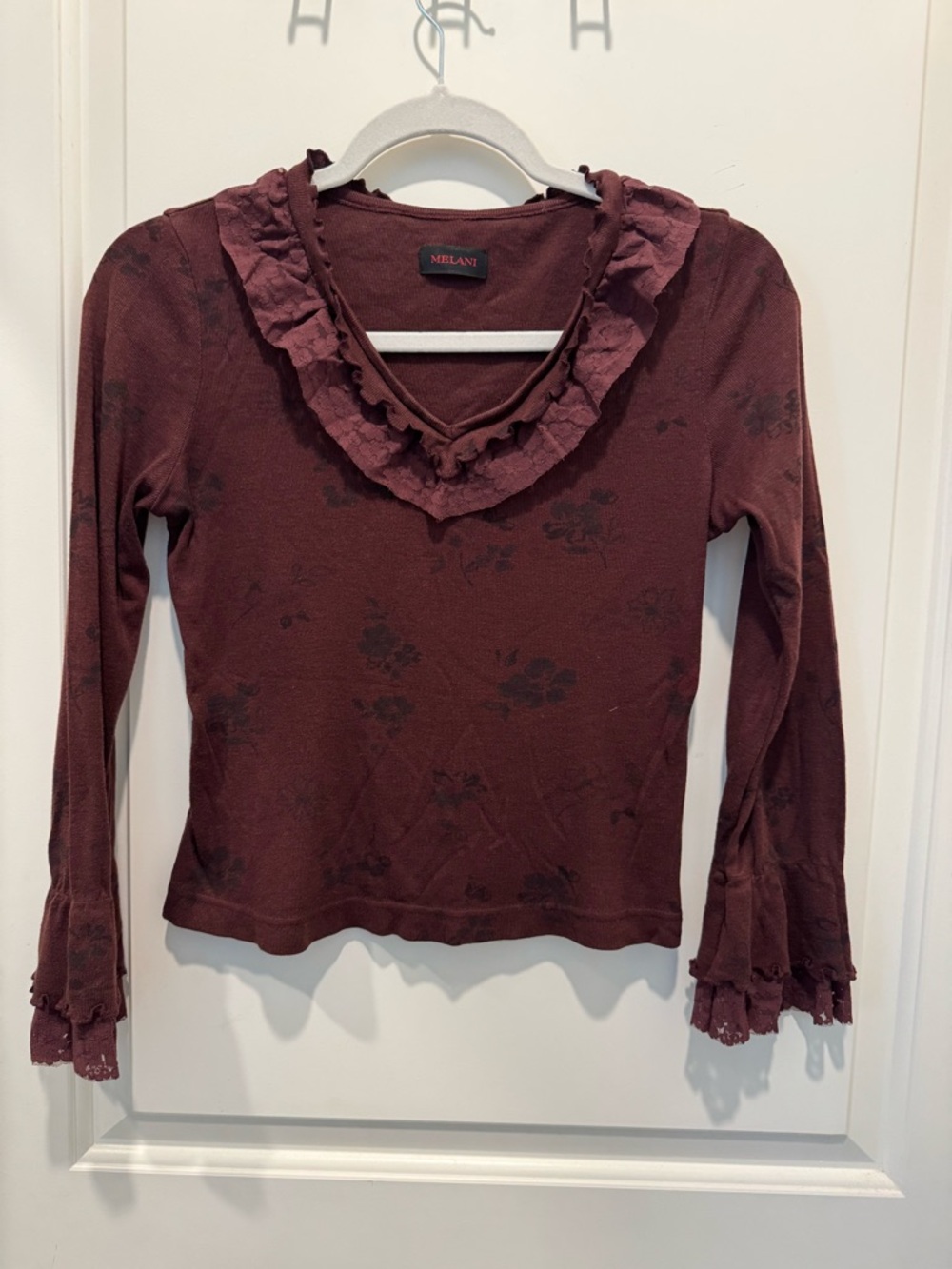 Melani ruffled long-sleeve blouse in a dark red floral
print